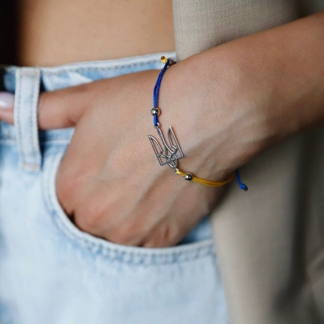 Sterling silver Trident bracelet with blue-yellow cord
