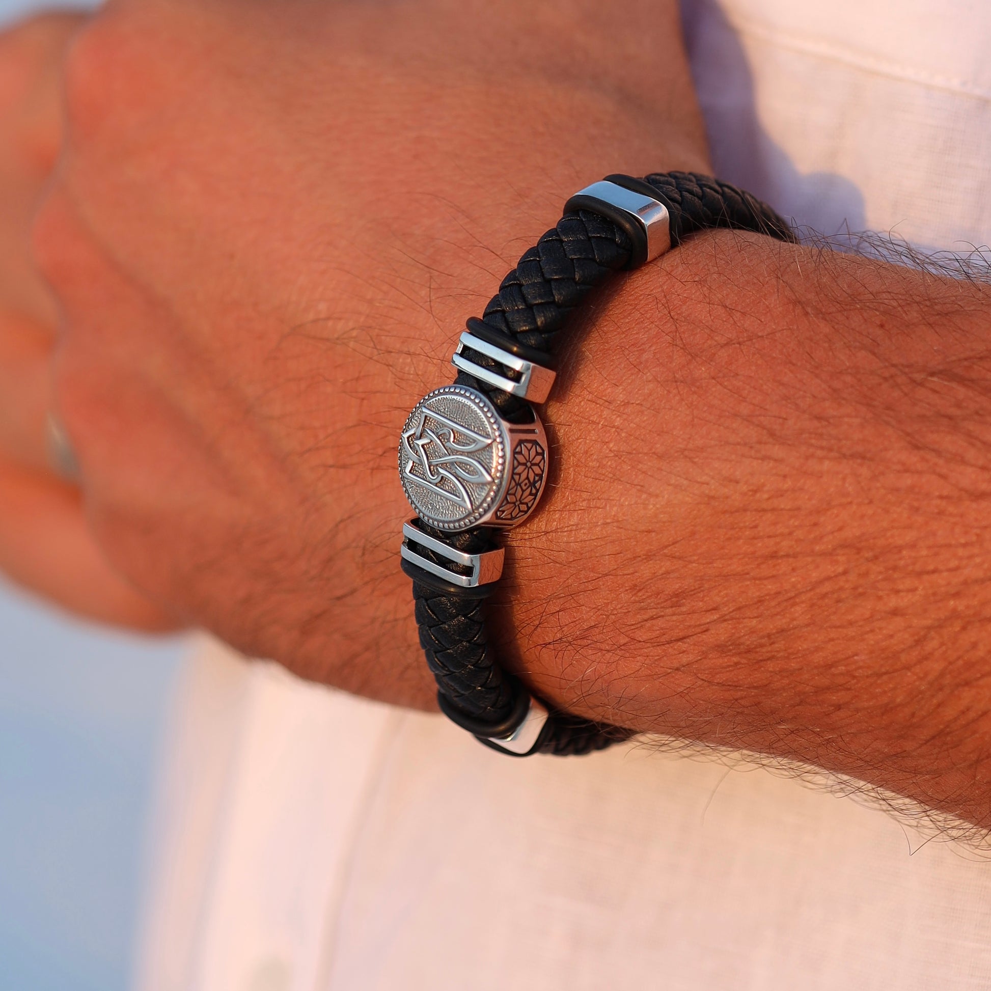 Men’s braided leather bracelet with 925 sterling silver and Tryzub design. Ukrainian craftsmanship — a symbol of strength and freedom.