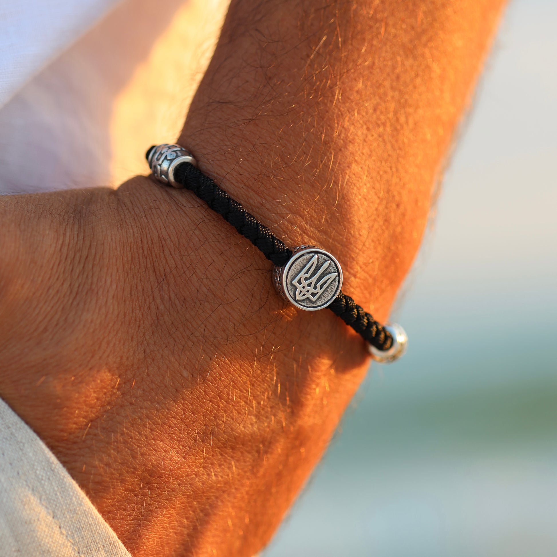 Close-up of men’s bracelet, luxury Ukrainian silver jewelry
